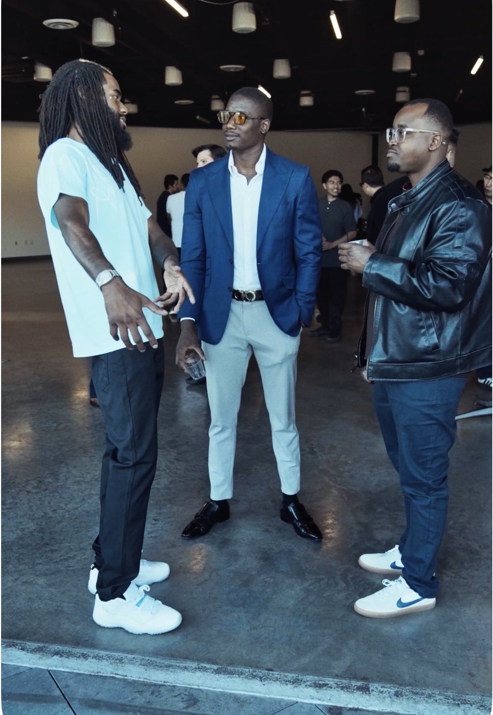 Jayy Klipsz speaking with founders during a business networking conversation