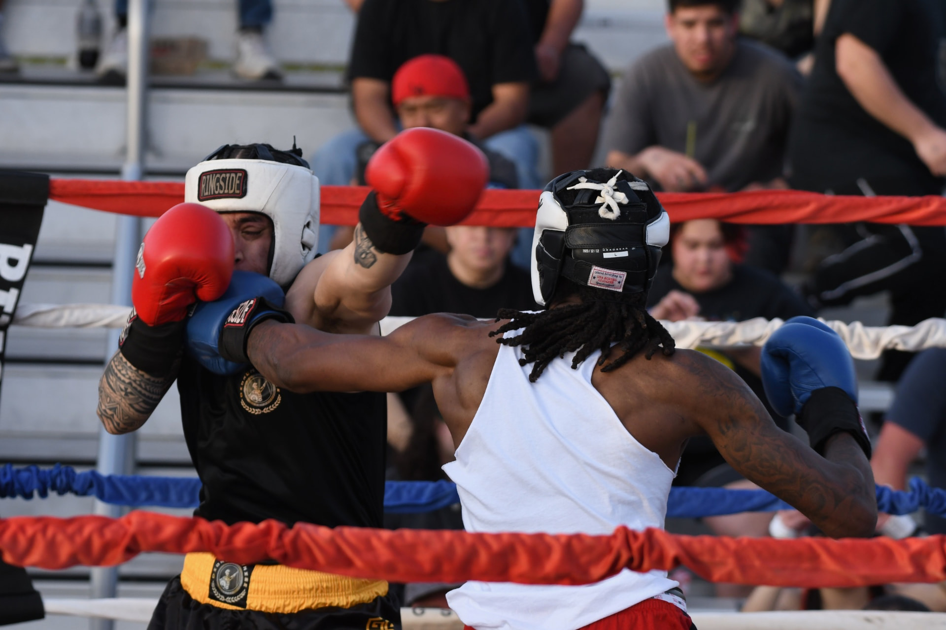 Jayy Klipsz exchanging punches with an opponent during an outdoor bout